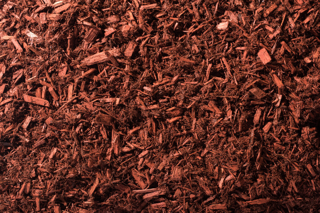 Color enhanced brown mulch